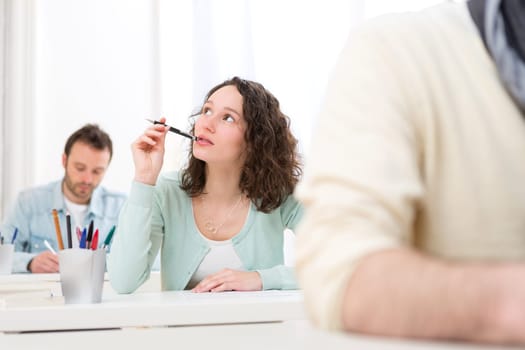 View of a Young attractive student taking exams