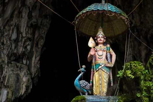 Colorful statue of Hindu God in Batu caves Indian Temple, Kuala Lumpur, Malaysia