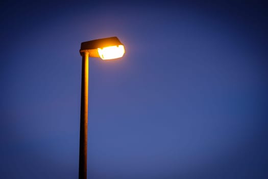 Street light in night with blue sky