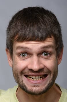 Closeup portrait of an insanely joyful man of European appearance
