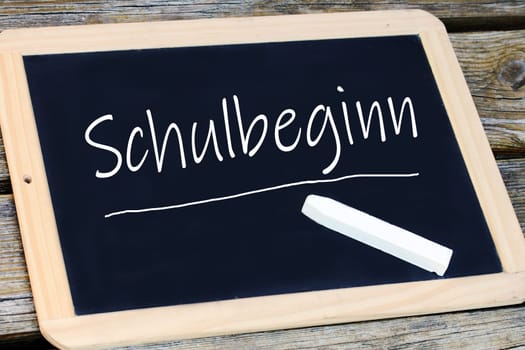 On a blackboard the start of school is written. School starts again
