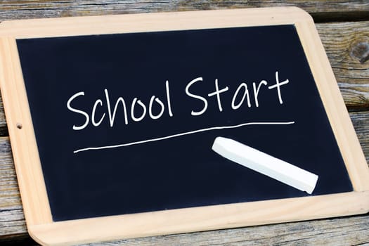 On a blackboard the start of school is written. School starts again