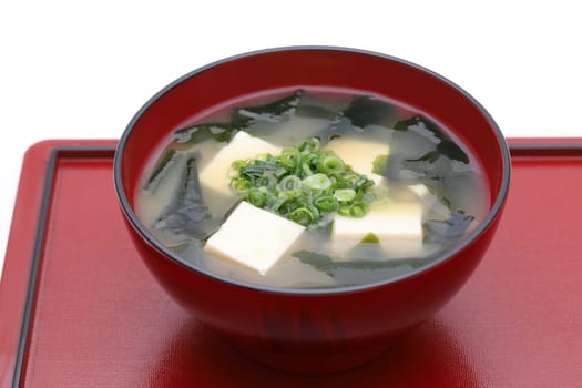 Japanese food, Miso soup of tofu and seaweed wakame in a bowl on tray