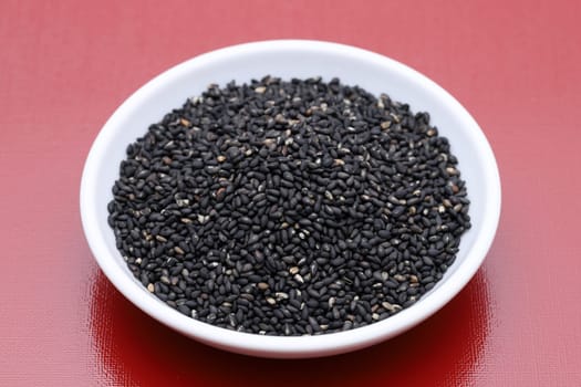 black sesame seeds in a bowl on table