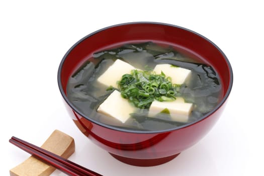 Japanese food, Miso soup of tofu and seaweed wakame in a bowl with chopsticks