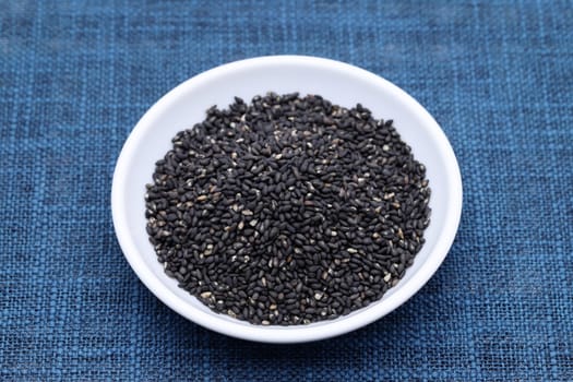 black sesame seeds in a bowl on table