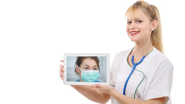 a young cheerful woman doctor is showing tablet with nurse and mask, isolated