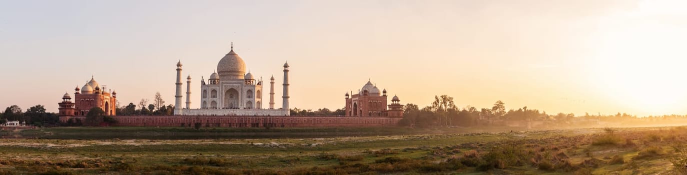 Taj Mahal sunset panorama, view from Yumana river, Agra, India.