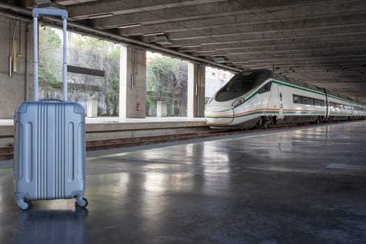 Suitcase at european high-speed rail station. Travel on train concept