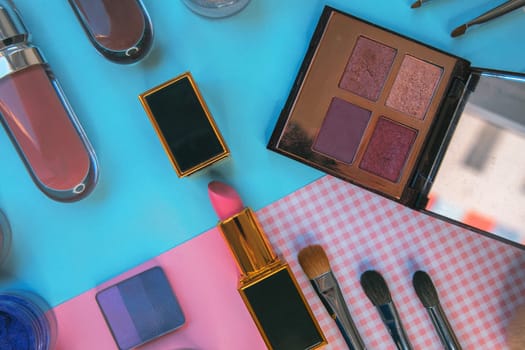 Set of decorative cosmetics on color background