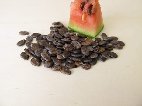 Dried watermelon seeds on a wooden board