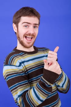 an young man portrait over a blue background