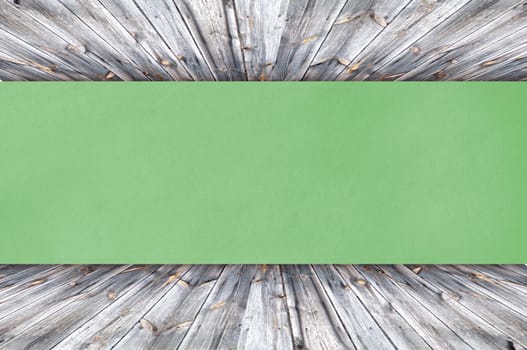 green paper on wood background or texture