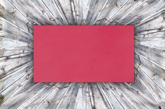 red paper on wood background or texture