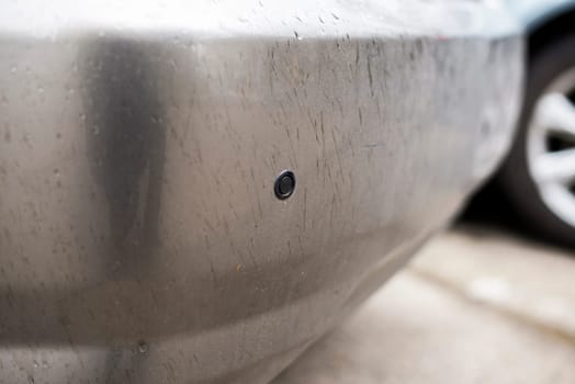 parking sensors on a car,rainy day