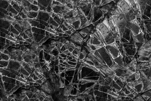 large glass pane broken in pieces
