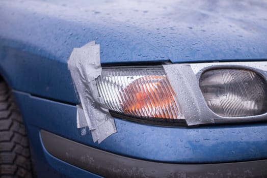 car accident,insurance concept with adhesive tape on lights