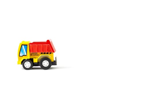 Earth moving toy. Yellow and red truck.