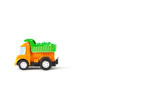 Earth moving toy. Orange and Green truck.