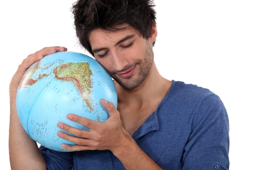Man hugging a globe