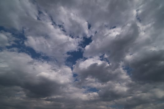 dramatic sky with cumulus clouds for use as background