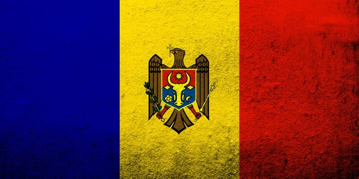 The Republic of Moldova National flag. Grunge background