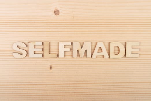 Term from wooden letters on pale wood
