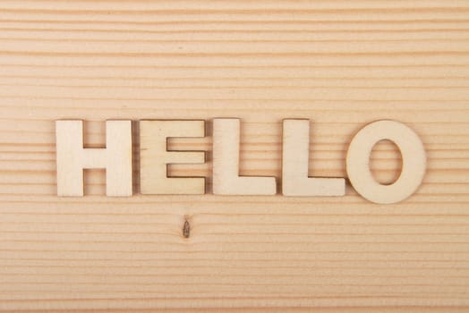 Term from wooden letters on pale wood