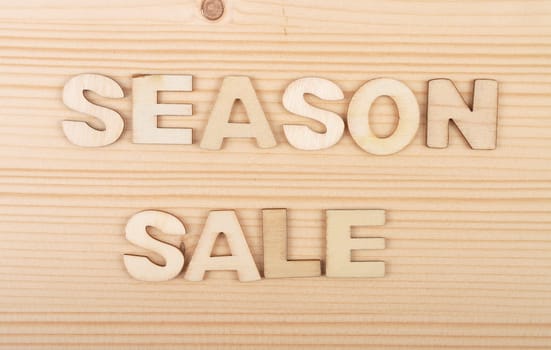 Term from wooden letters on pale wood