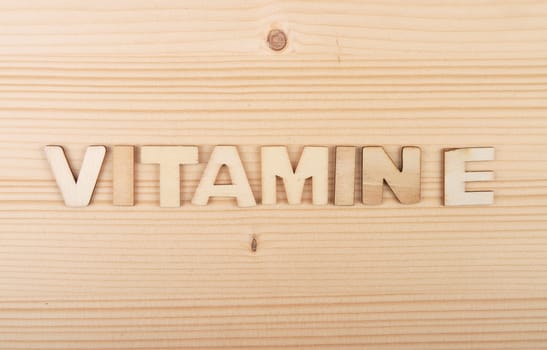 Term from wooden letters on pale wood