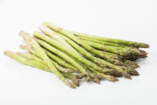 green asparagus on white background