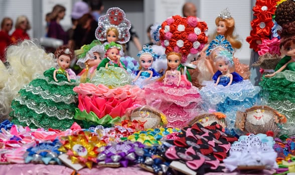 Krasnodar, Russia - May 1, 2019: Dolls girls in multi-colored dress. Dolls girls in multi colored dress