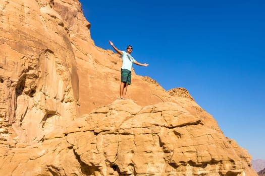 Man with open arms. Holy trip through the historic cities of Israel