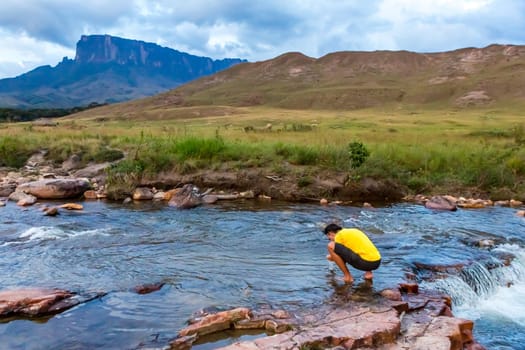 Man relaxing in nature. Mount Roaima, Venezuela.