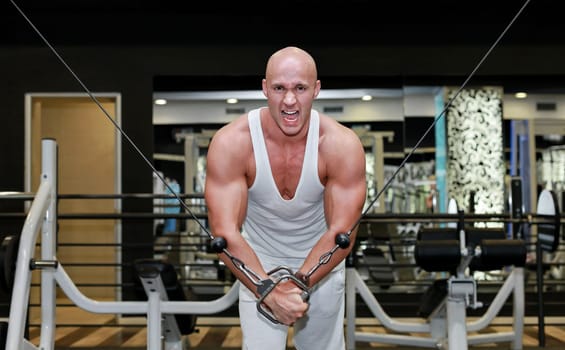 Young strong man workout exercise in gym