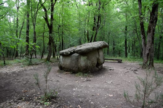 Dolmen in Shapsug. Forest in the city near the village of Shapsugskaya, the sights are dolmens and ruins of ancient civilization.