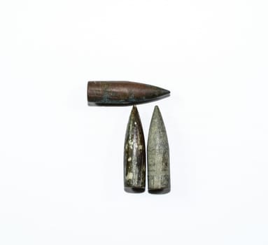 Old rusty bullets from a Kalashnikov assault rifle.