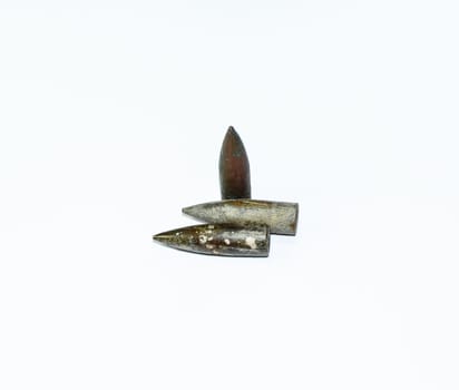 Old rusty bullets from a Kalashnikov assault rifle.