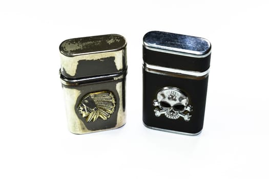 Reusable steel lighters. Creative lighters on a white background.
