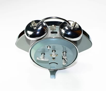 An old mechanical alarm clock. The watch is mechanical with an alarm clock.