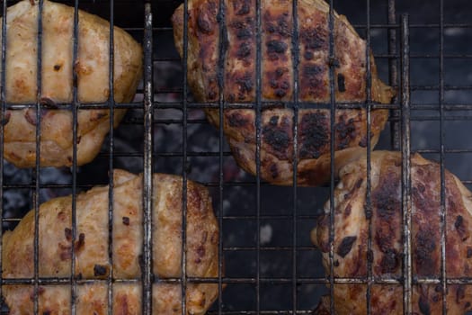 Delicious meat, grilled on a grill with a delicious crust cooked in the open air