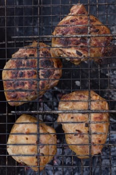 Delicious meat, grilled on a grill with a delicious crust cooked in the open air