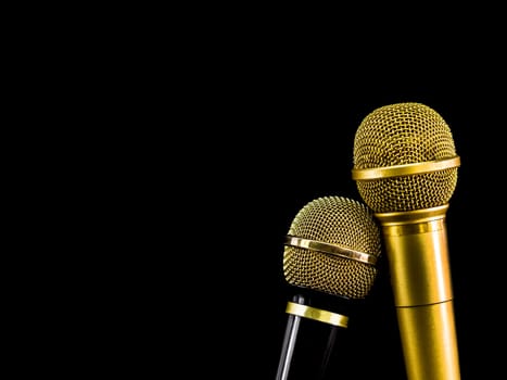Two microphone on black background.  Object for entertainment concept.