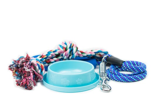 Pet bowls, Rope and Leash with hook on isolated white.  Pet supplies concept