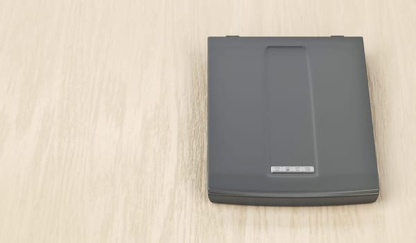 Computer scanner on wooden desk