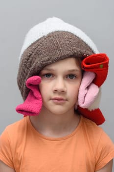Portrait of a funny girl with a bunch of things on her head
