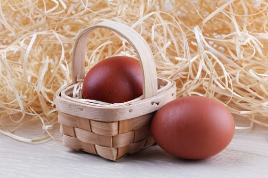 Two eggs basket wood straw