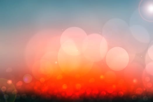 Abstract sunset illustration. Abstract tropical evening or desert sunset mood background texture with red and pink colored bokeh lights and a cloudy blue sky. Beautiful sunset backdrop.