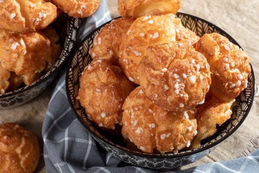 Chouquette, french choux pastry on the wooden table