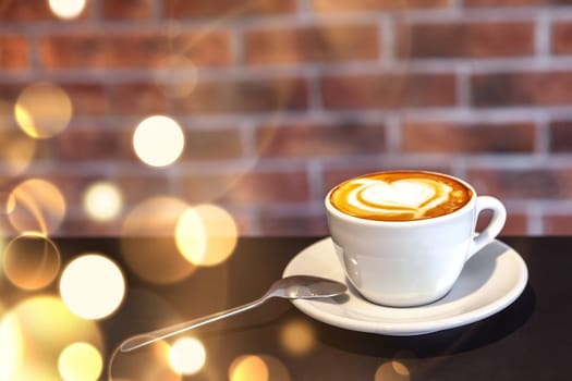 A cup of coffee on a with heart, valentines day, red wall, restaurant photo